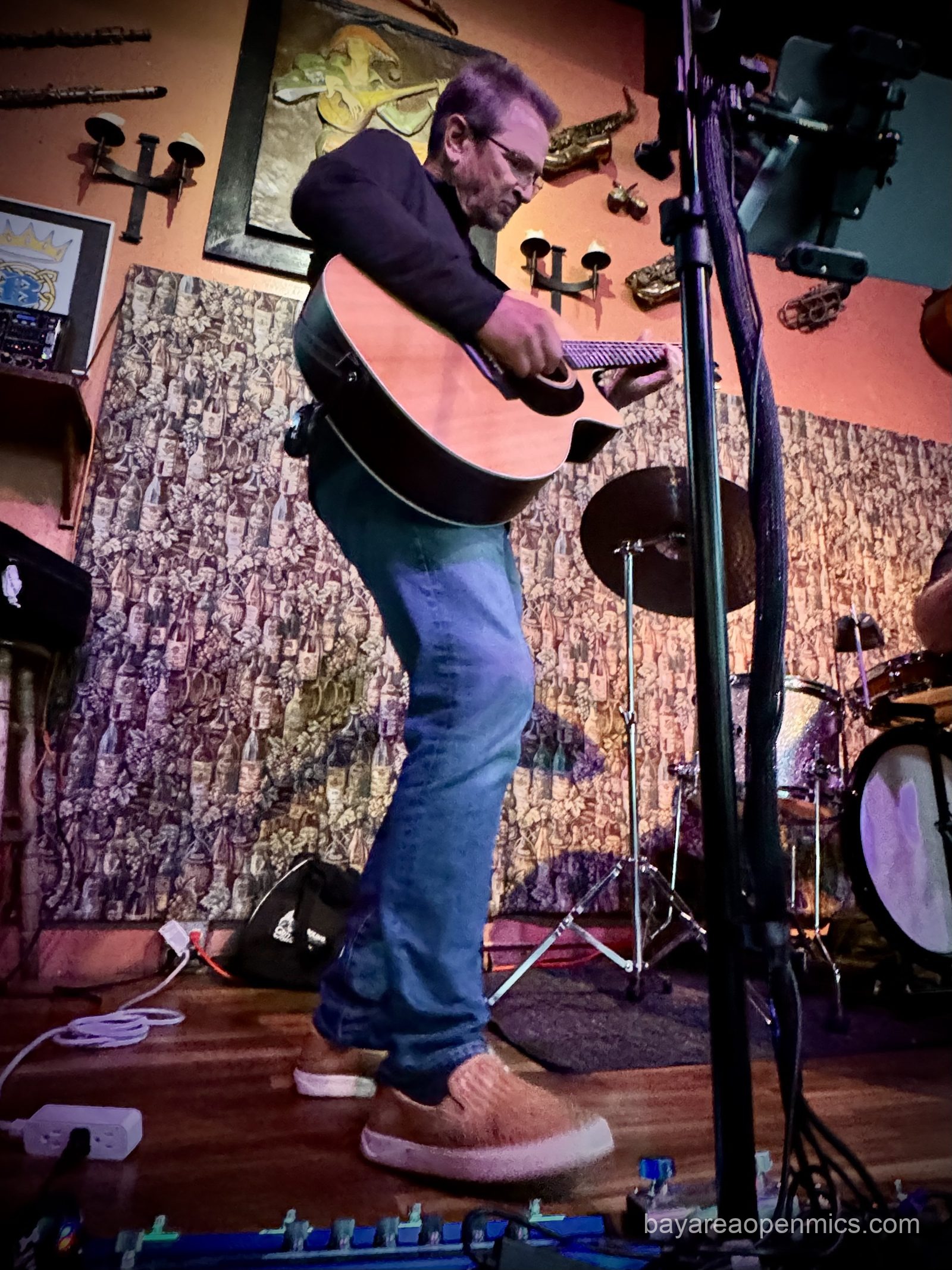 Joel shredding on acoustic guitar at the Hayward Bistro Open Mic