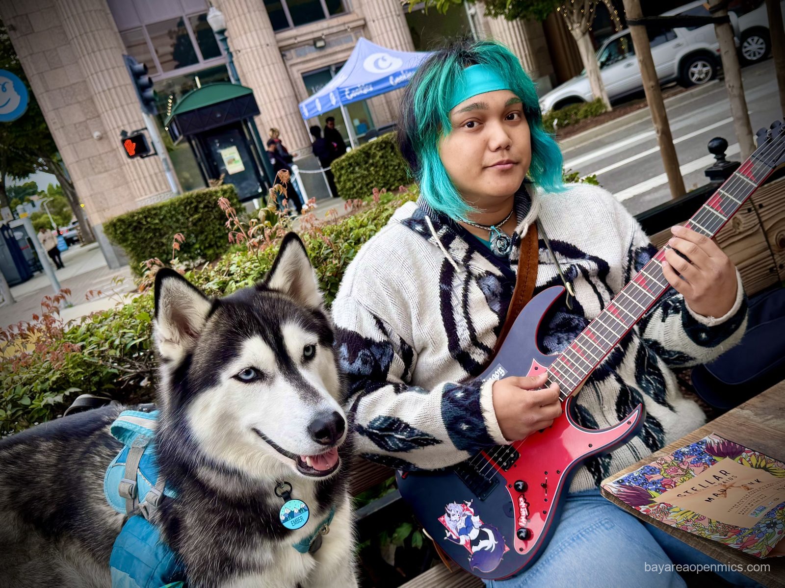 Emenefer and their faithful Husky canine companion, Ember, outside the Hayward Bistro Open Mic