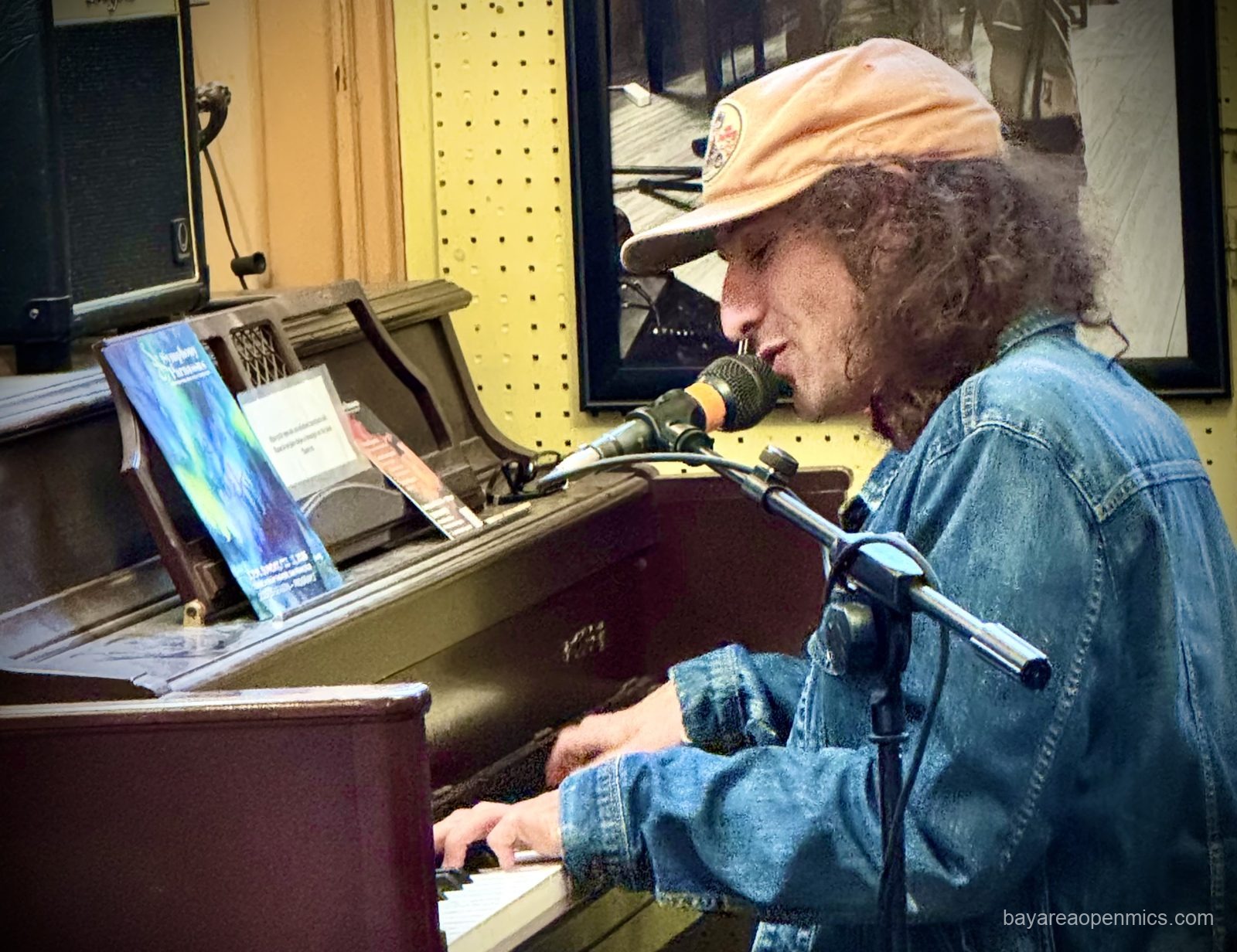 Little Oil performs on piano at Simple Pleasures Cafe