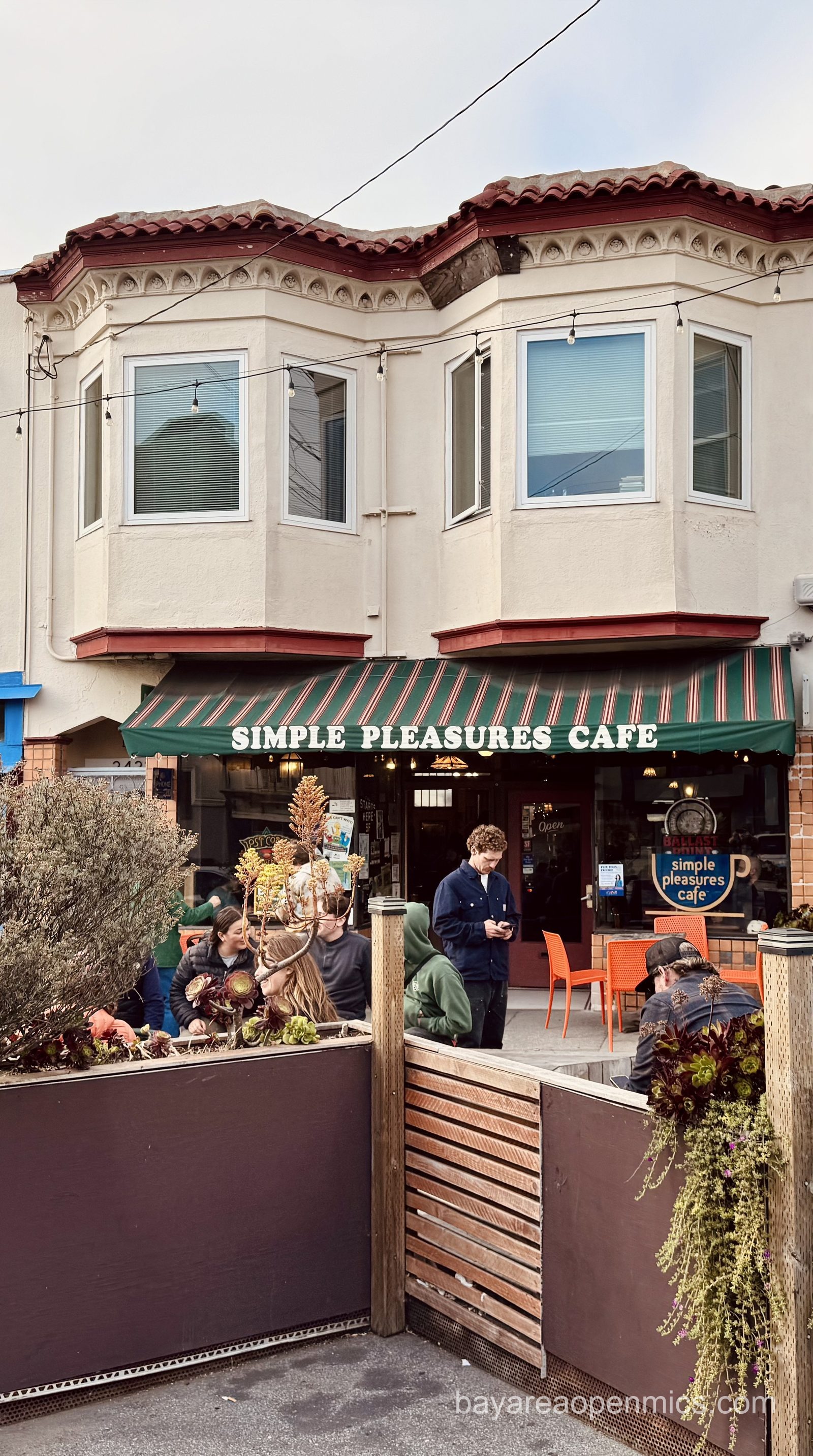 The exterior of Simple Pleasures Cafe in San Francisco, showing the parklet out front