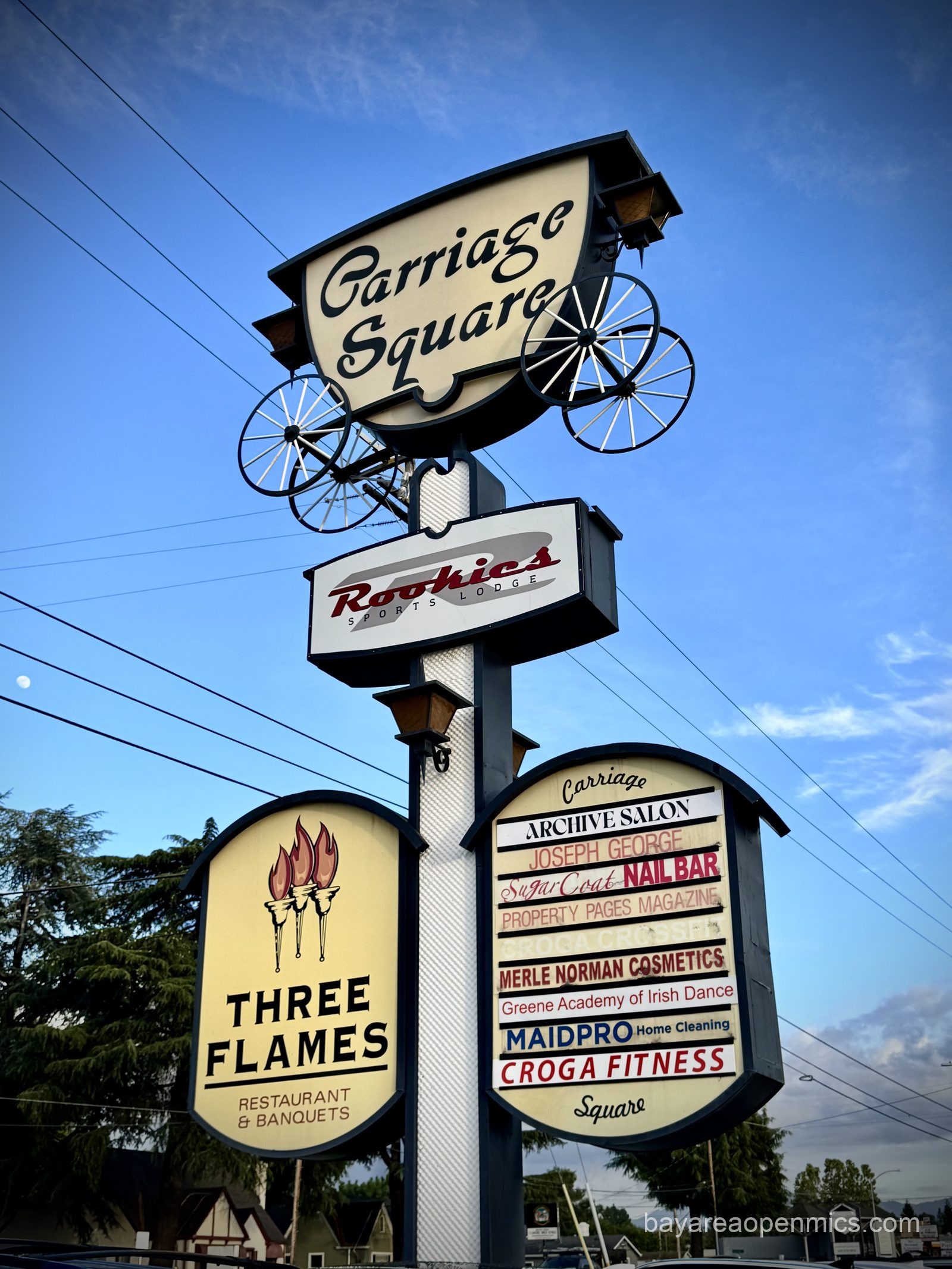 The mid-century signage outside Carriage Square in San Jose, home of Three Flames Restaurant