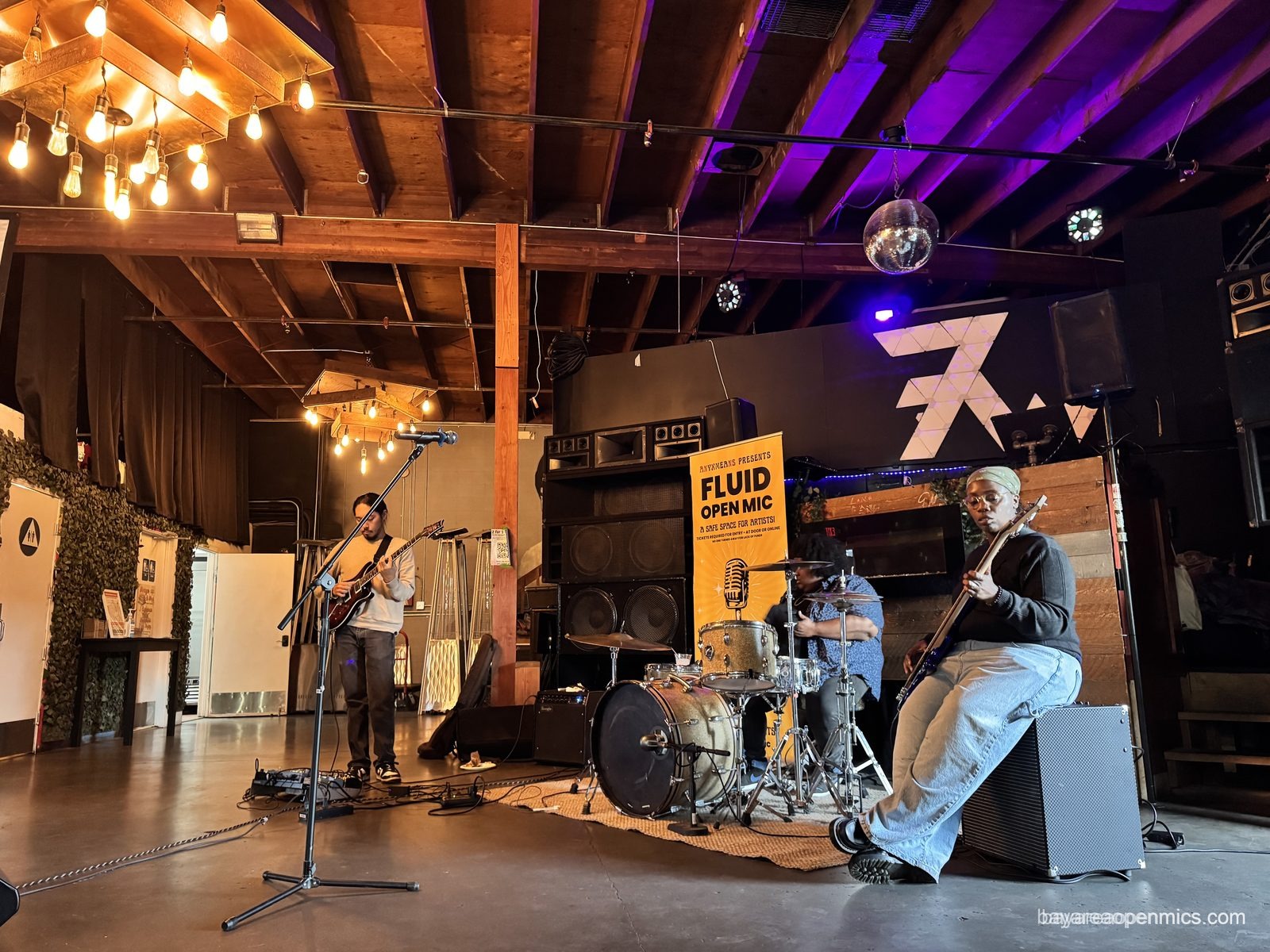 The Vibe Muzik house band performs at the Fluid open mic at 7th West