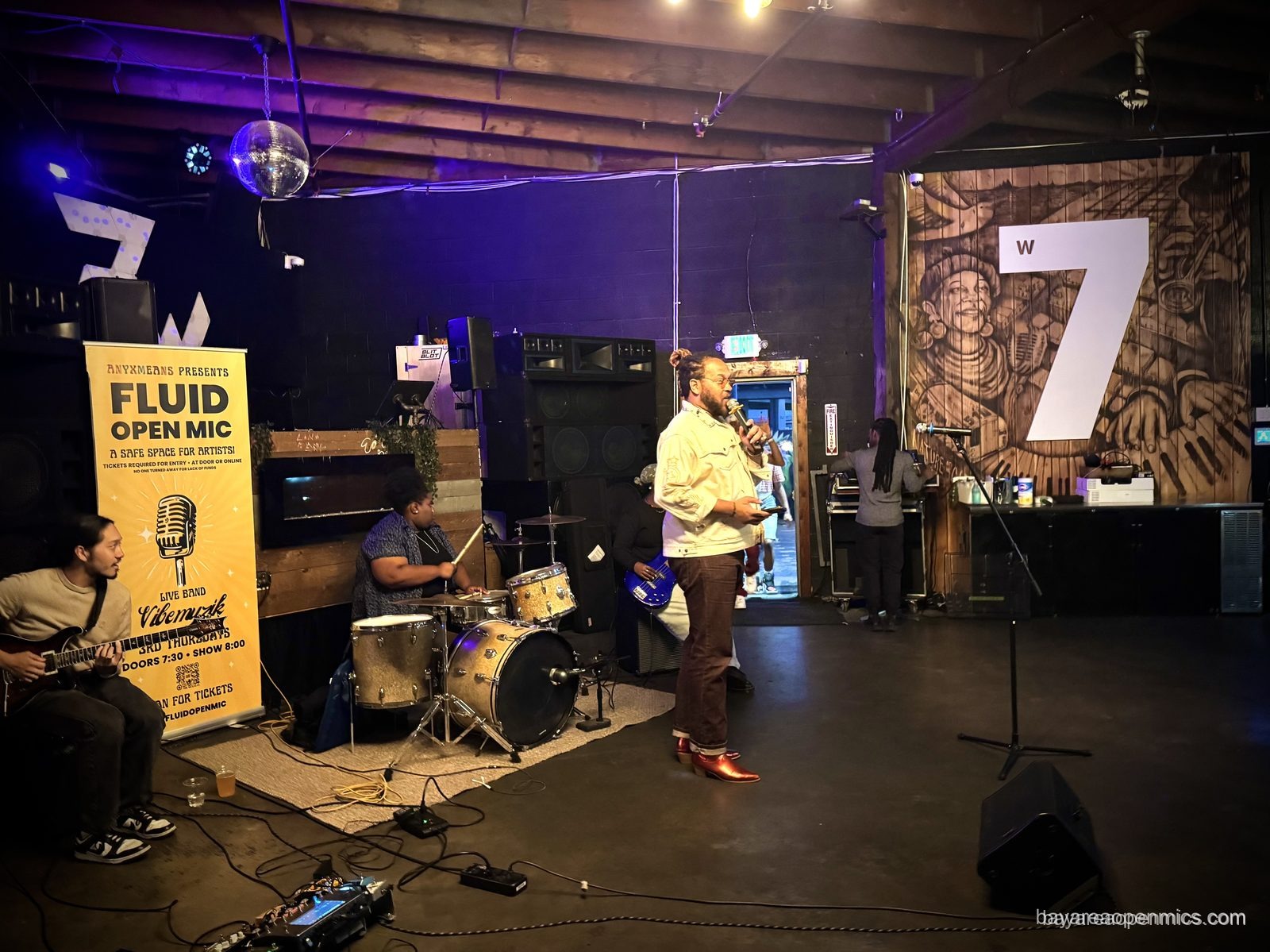 Muzik Ra performs with the Vibe Muzik house band at the Fluid open mic