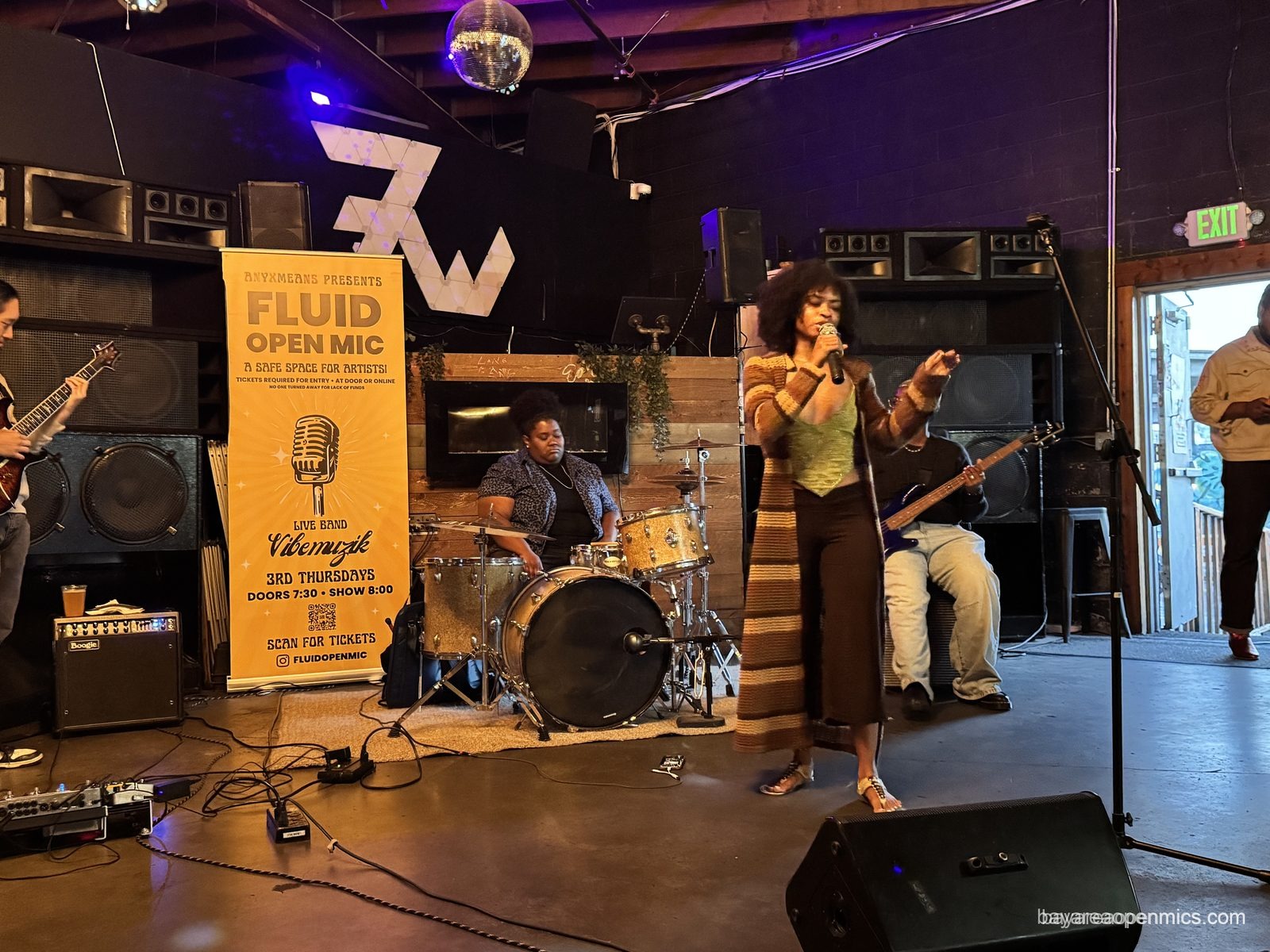 A singer at the Fluid open mic at 7th West in West Oakland