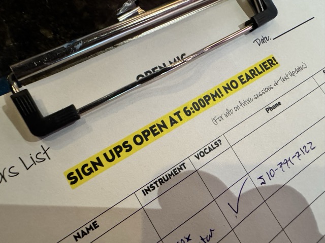 The open mic sign-up sheet on a clipboard at the end of the bar at Pinot's Palette in Livermore