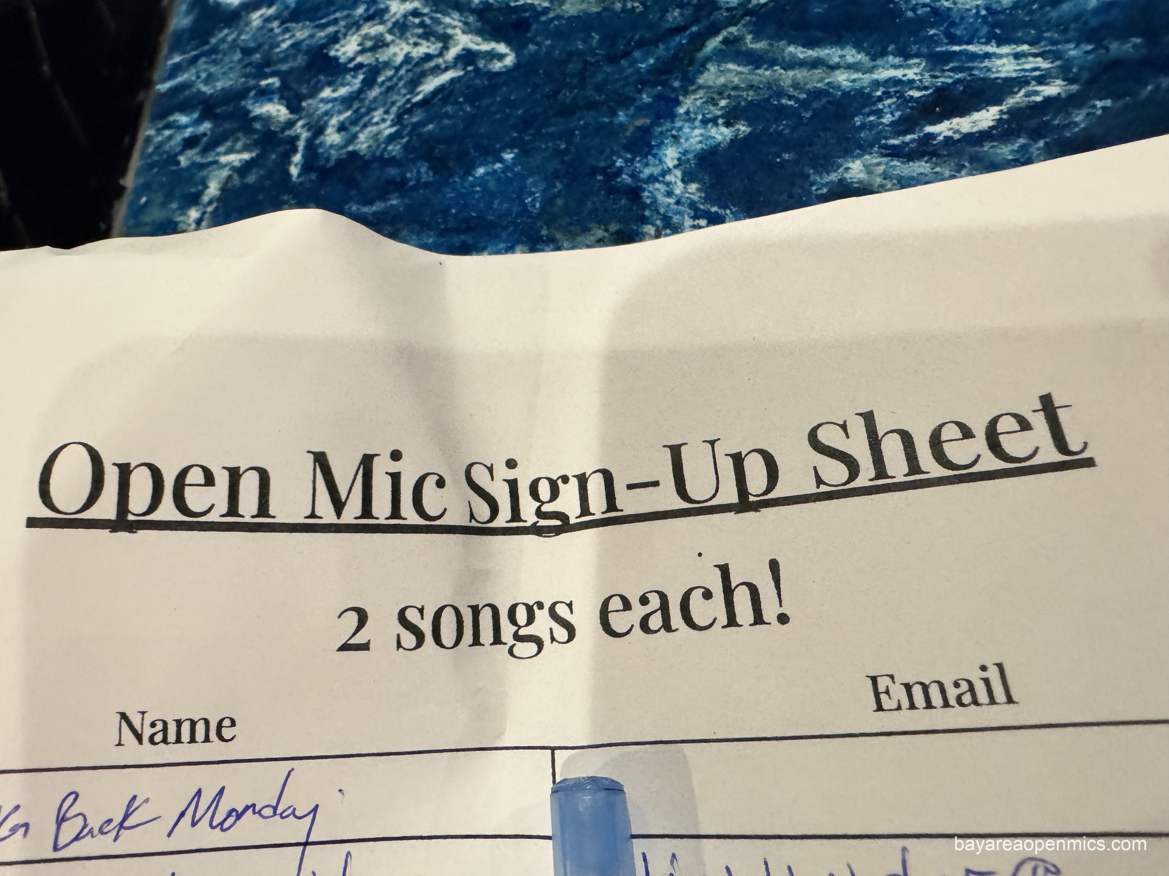 A printed page header reads 'Open Mic Sign-Up Sheet 2 songs each!'