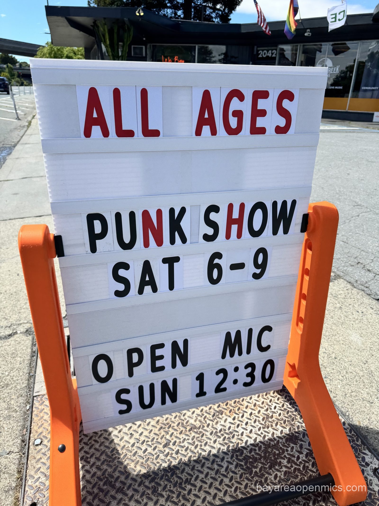 A sign outside advertises the Sunday Up The Creek Records open mic