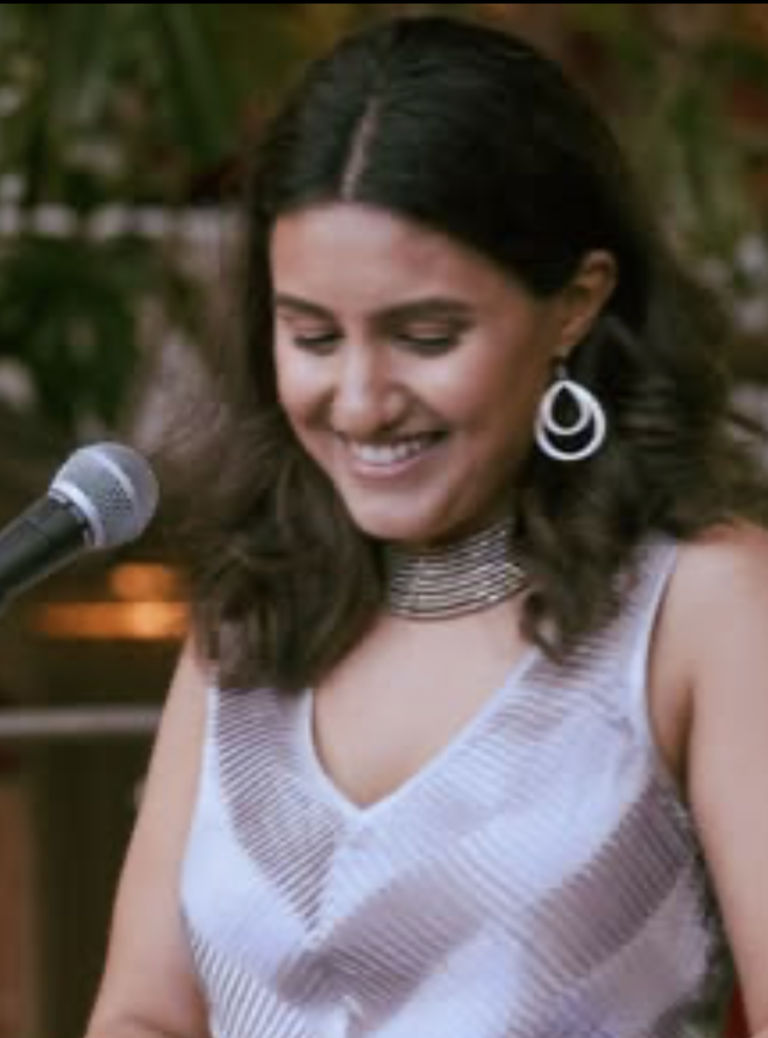 Rhea Joseph performing live, host at Decentered Arts Open Mic